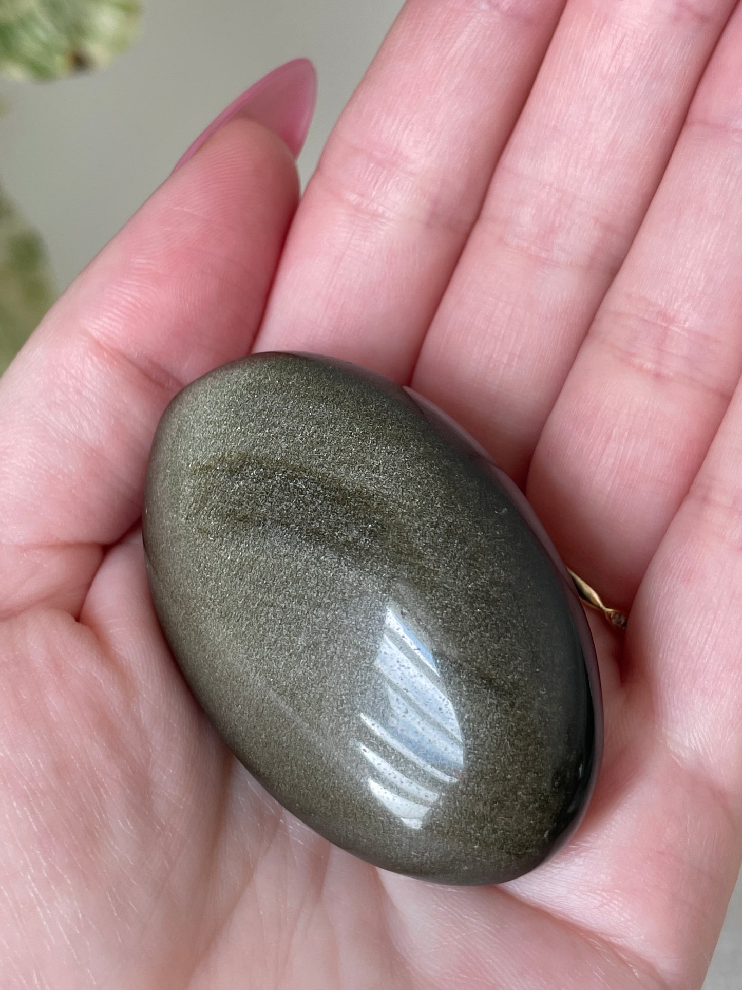 Meditation Palm Stone Gold Sheen Obsidian Natural Crystal Energy Work Tool Spiritual Practice Aid Personal Transformation Guide Sacred Space Essential Smooth Polished Naturally Shimmery Daily Ritual Companion Manifestation Support Crystal
