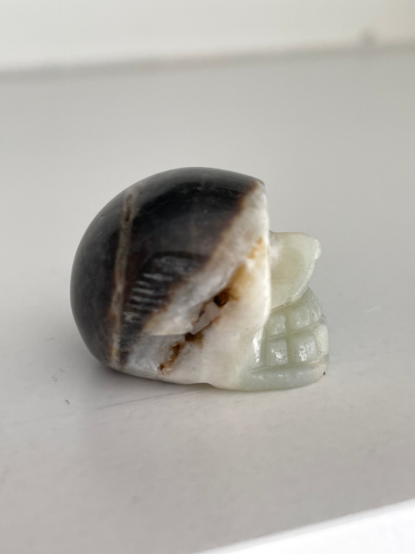 Hand carved skull crystal, 1-inch druzy calcite stone for altar or decor.