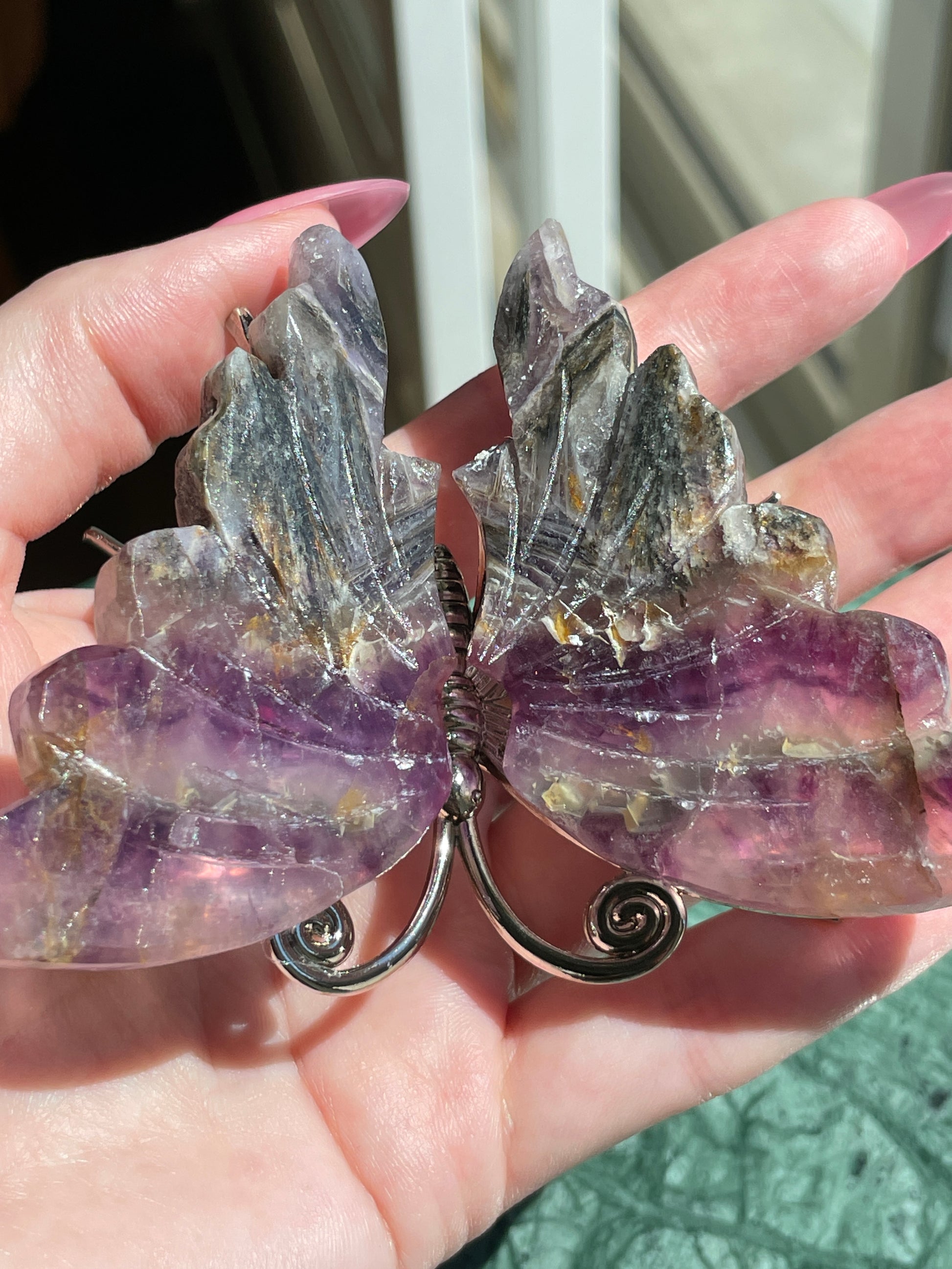 Feathered Root Fluorite Butterfly Crystal Carving Natural Stone Display Piece Purple Striped Pattern Gold Gray Details Metal Accented Design Spiritual Transformation Symbol Meditation Focus Object Crystal Collection Showcase Beautiful