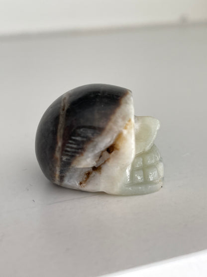Hand carved skull crystal, 1-inch druzy calcite stone for altar or decor.