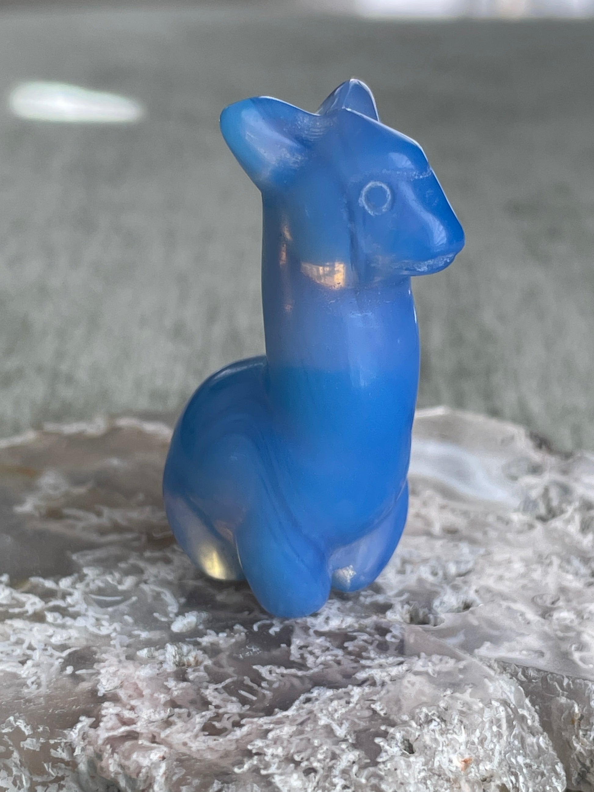 hand-carved blue opalite llama figurine, luminous gemstone carving for balance and perseverance