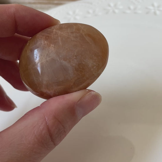 peach moonstone palm stone crystal gift