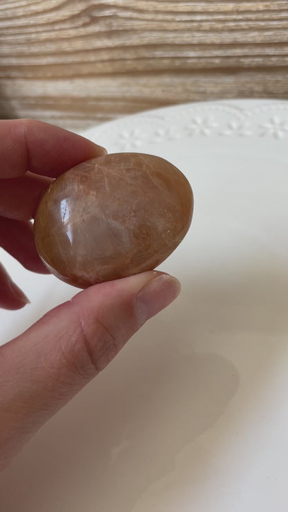 peach moonstone palm stone crystal gift